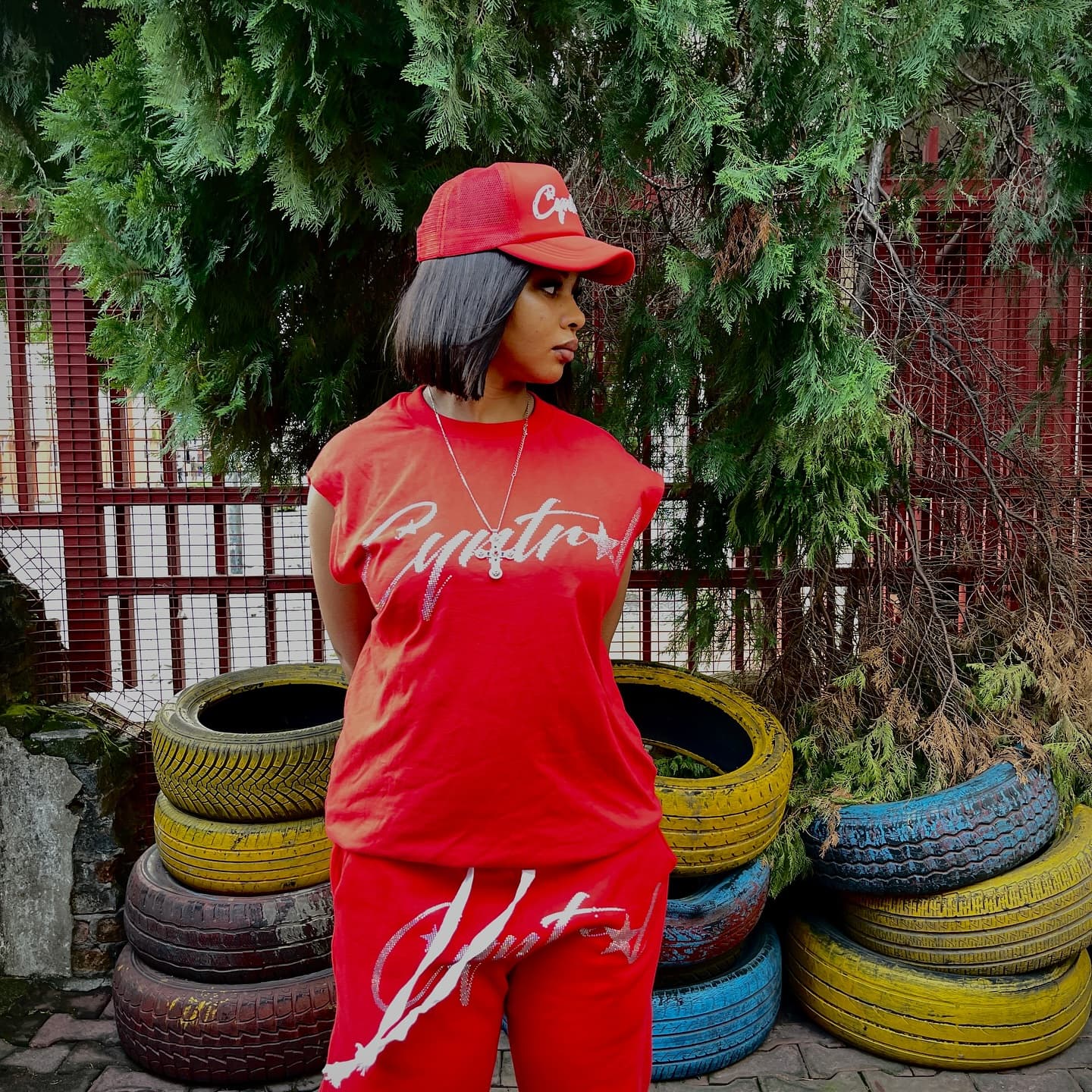Red set portrait by stacked tyres